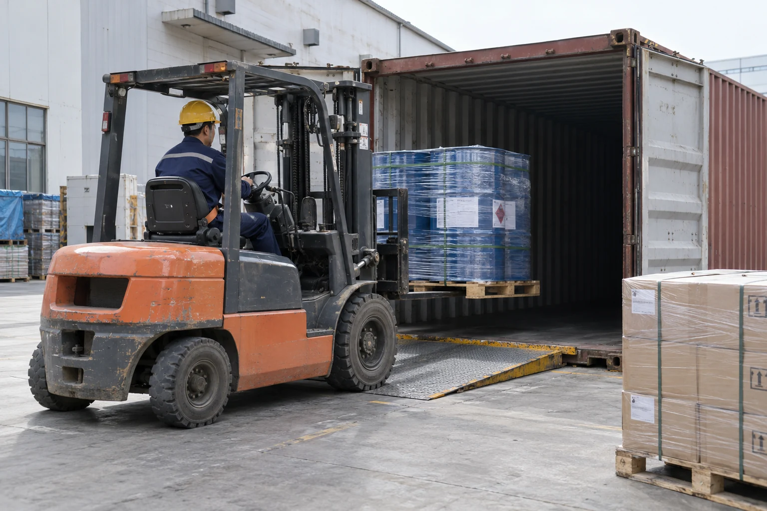 a generic container-loading scene with sealed drums.