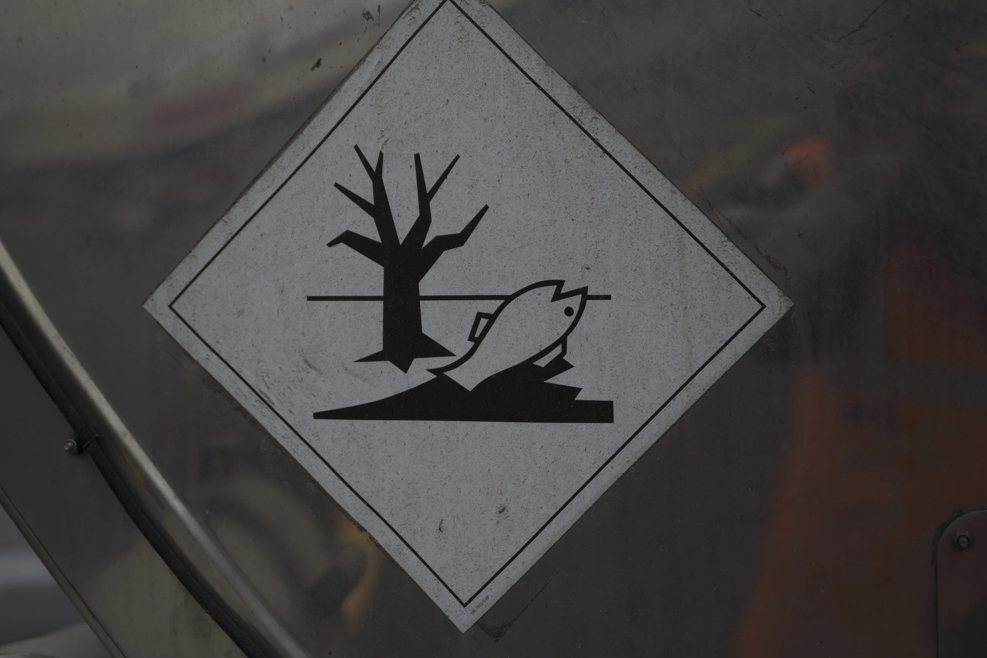The fish-and-tree marine pollutant mark on a chemical tanker, photographed in 2013.